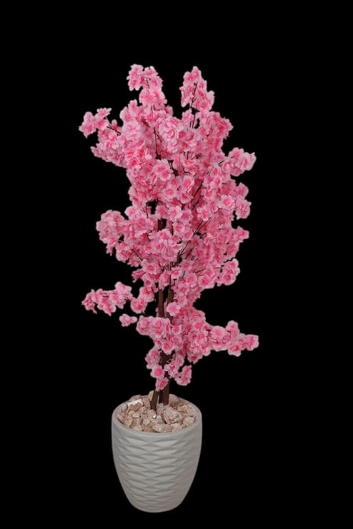 Artificial jasmine plant, 150 cm tall, with a dense, three-stemmed design. A realistic artificial tree for indoor and outdoor use, complete with a plastic pot, pebbles, and lush foliage. Pink color.