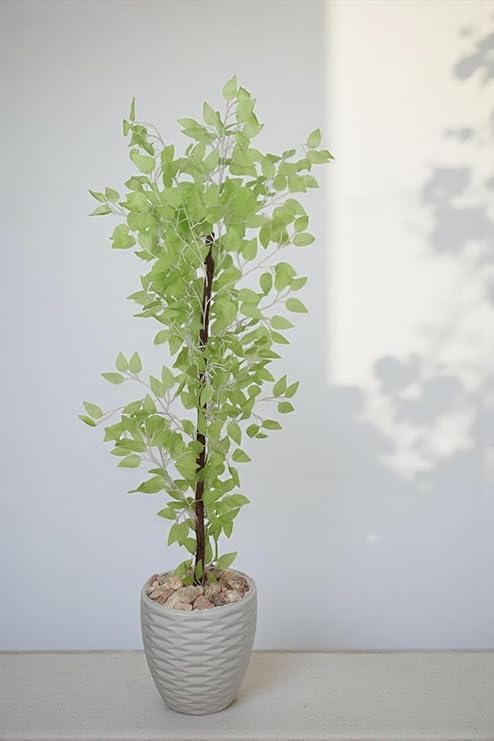 Realistic artificial Benjamin tree with a wooden trunk, plastic leaves, and decorative pebbles in a plastic pot for indoor and outdoor use, 1.45m tall