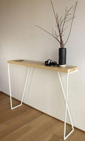A modern slim console table with a white metal frame and natural wood top; a narrow entryway table for the hallway, kitchen, or behind the sofa.