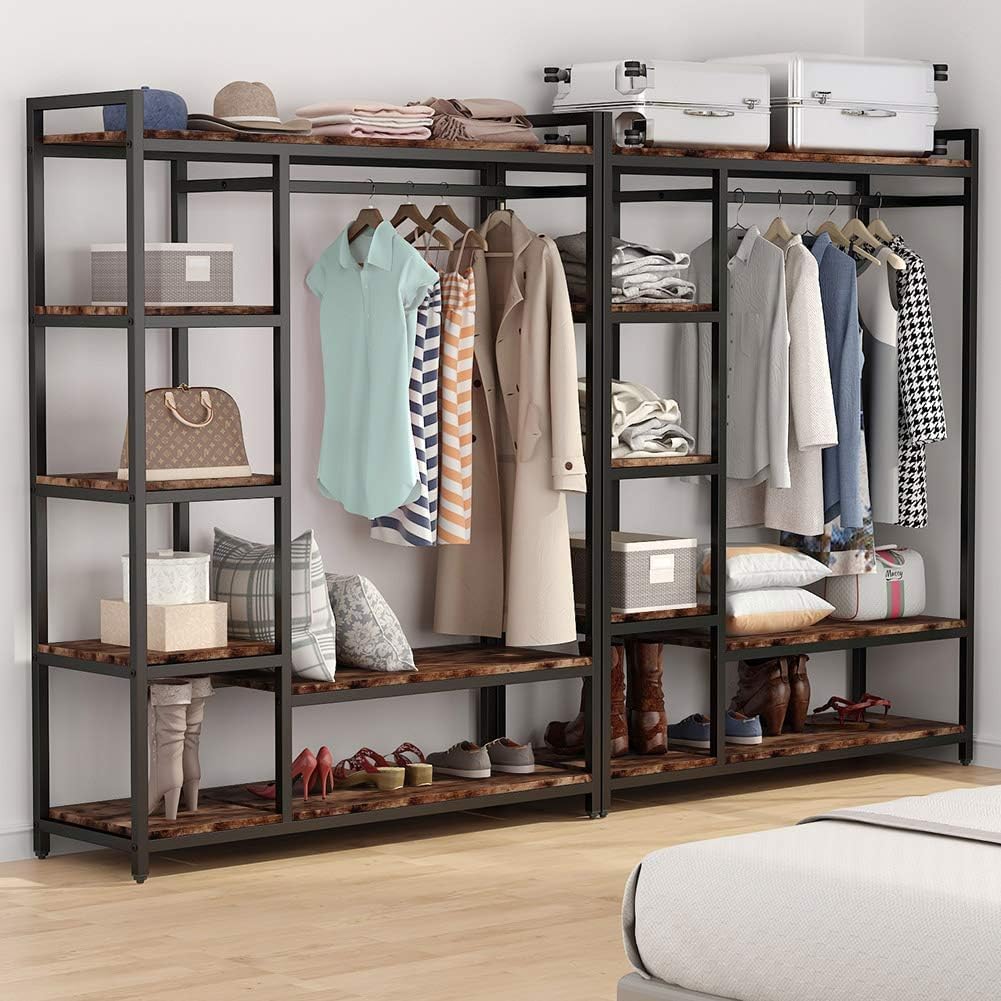 A freestanding wooden clothes rack from Dressing Ventura, heavy-duty with...