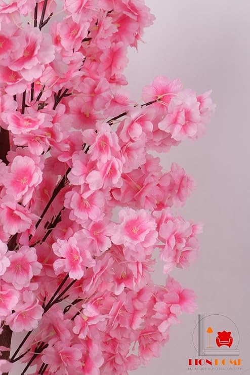 Artificial jasmine plant, 150 cm tall, with a dense, three-stemmed design. A realistic artificial tree for indoor and outdoor use, complete with a plastic pot, pebbles, and lush foliage. Pink color.