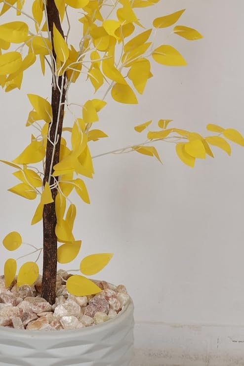 A dense artificial Benjamin fig tree, a realistic artificial tree for indoor and outdoor use, complete with a wooden trunk, plastic leaves, and decorative pebbles in a pot by Lion Home, 1.65m tall, yellow color.