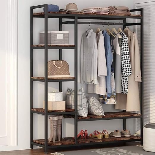 A freestanding wooden clothes rack from Dressing Ventura, heavy-duty with...