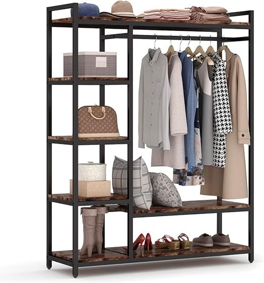 A freestanding wooden clothes rack from Dressing Ventura, heavy-duty with...