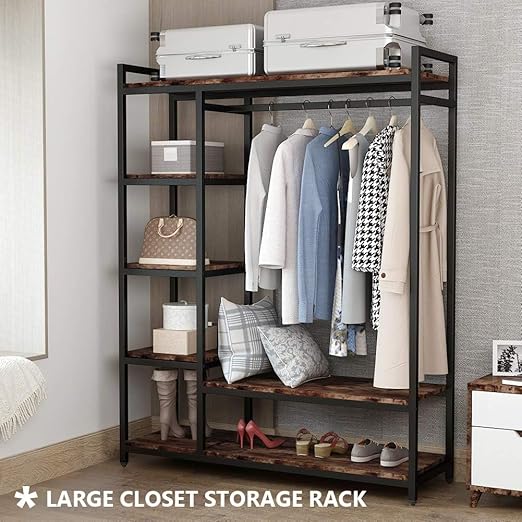 A freestanding wooden clothes rack from Dressing Ventura, heavy-duty with...