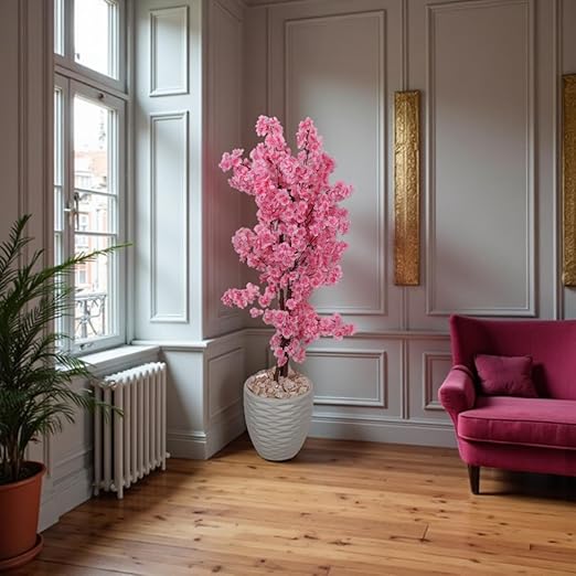 Artificial jasmine plant, 150 cm tall, with a dense, three-stemmed design. A realistic artificial tree for indoor and outdoor use, complete with a plastic pot, pebbles, and lush foliage. Pink color.