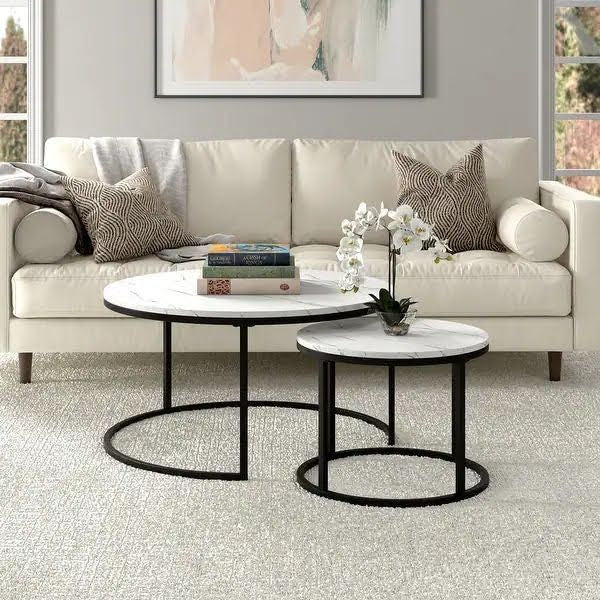 A center table made of two pieces of metal and marble wood.